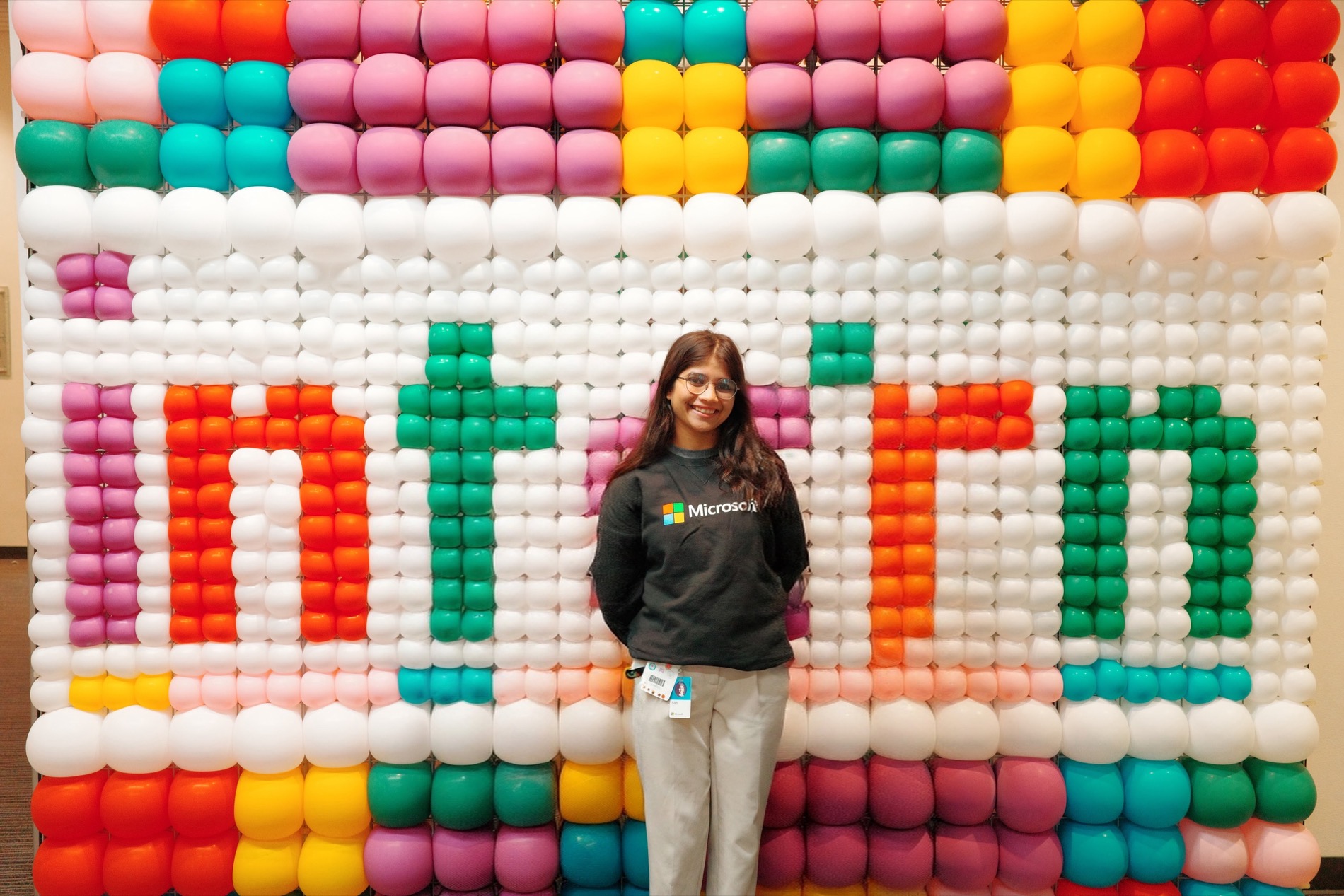 Sam at a colorful Microsoft installation